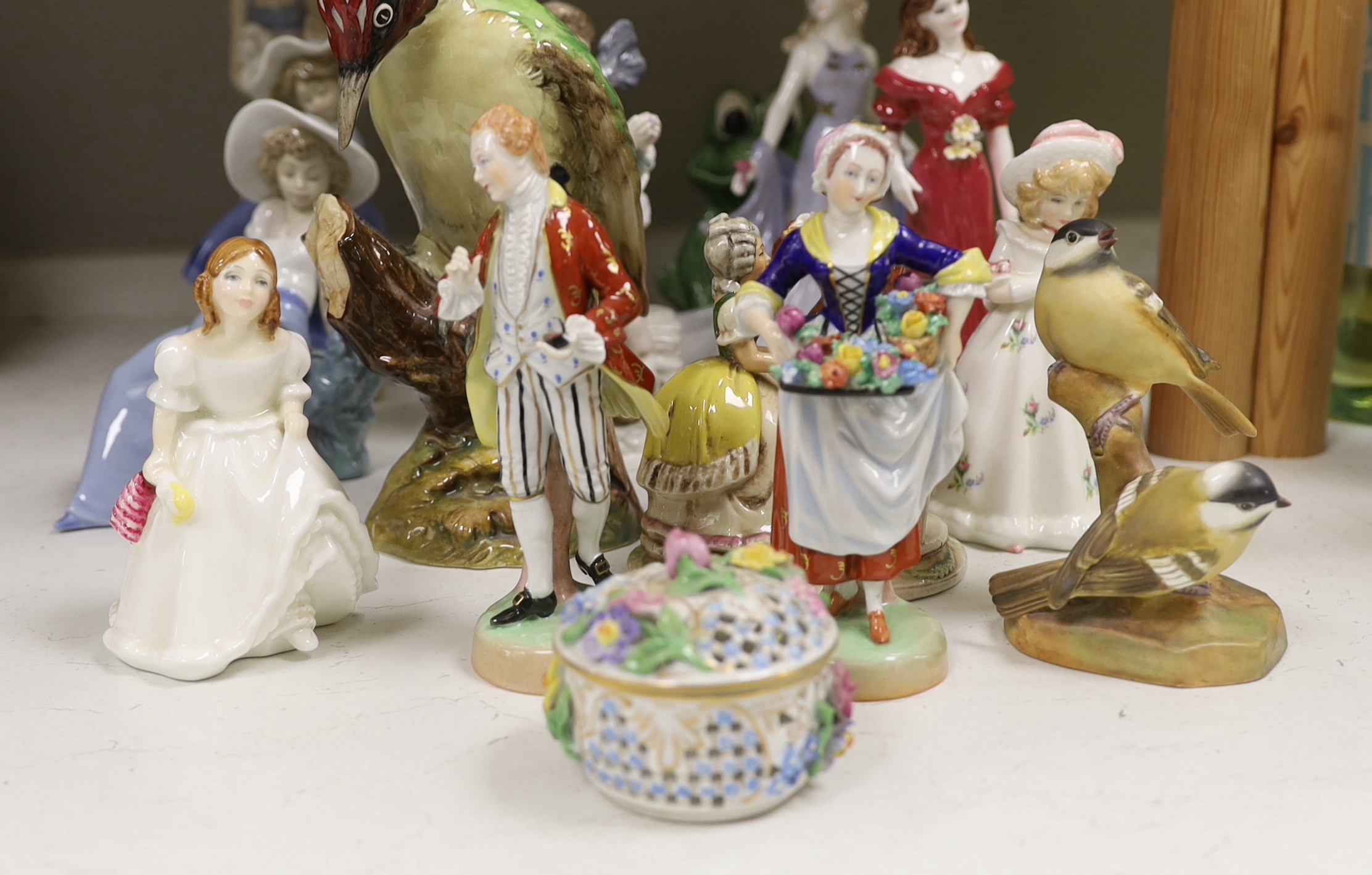 A large Beswick figure of a Woodpecker, Royal Worcester model of Coal Tits, five Coalport figurines and mixed Doulton, Lladro Nao and other figurines etc, tallest 22cm high
